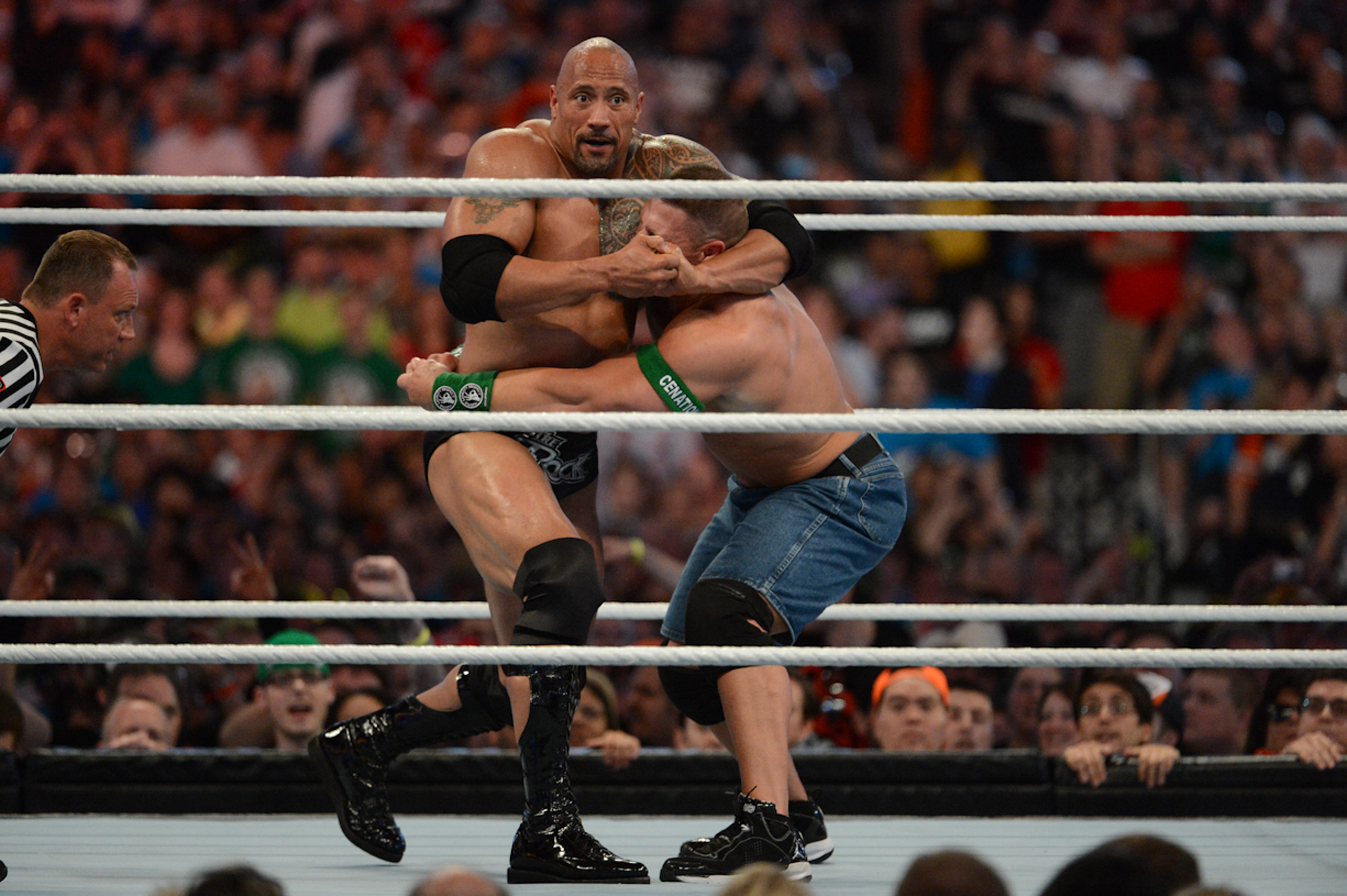 MIAMI GARDENS, FL - APRIL 1: Dwayne ''The Rock'' Johnson and John Cena in action during WrestleMania XXVIII at Sun Life Stadium on April 1, 2012 in Miami Gardens, Florida. (Photo by Ron Elkman/Sports Imagery/Getty Images)