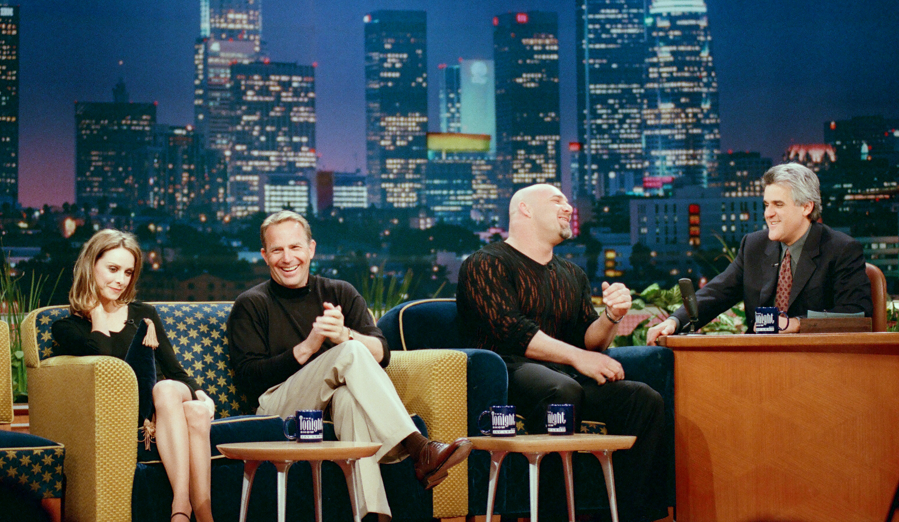 THE TONIGHT SHOW WITH JAY LENO -- Episode 1550 -- Pictured: (l-r) Actress Calista Flockhart, actor/director Kevin Costner, wrestler Goldberg, host Jay Leno during an interview on February 19, 1999 -- (Photo by: Joseph Del Valle/NBC/NBCU Photo Bank via Getty Images)