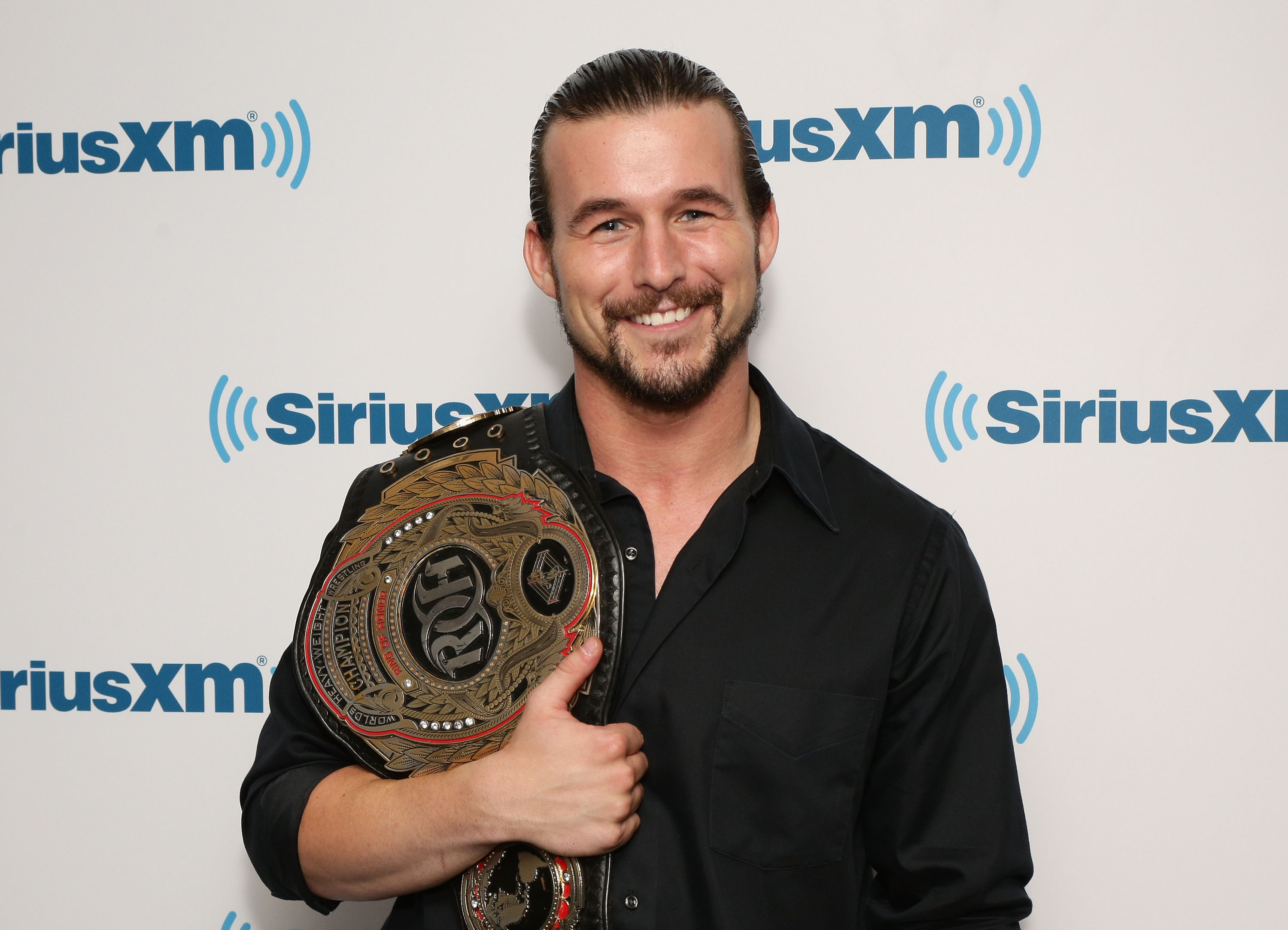 NEW YORK, NY - MAY 15: Wrestler Adam Cole from Ring Of Honor visits SiriusXM Studios on May 15, 2014 in New York City. (Photo by Andrew Toth/Getty Images)