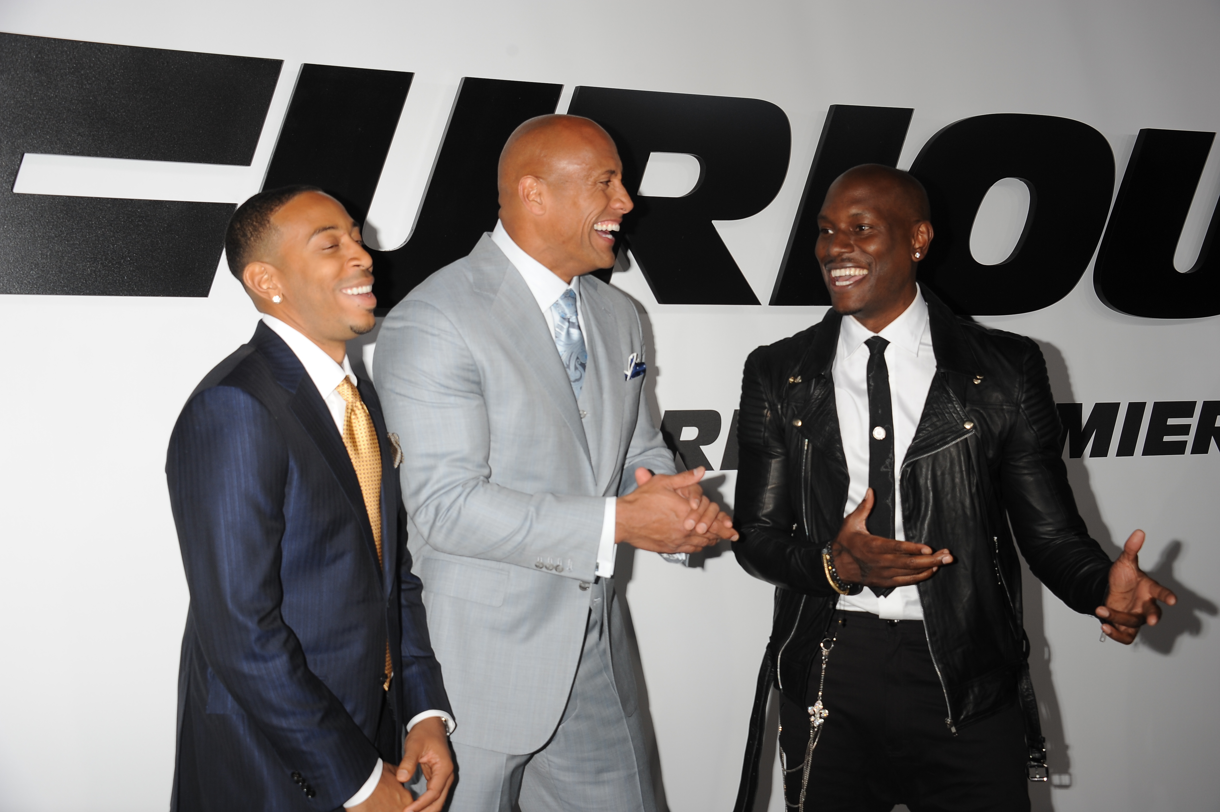 (L-R) Actors Chris 'Ludacris' Bridges, Dwayne Johnson and Tyrese Gibson arrive at the premiere of 