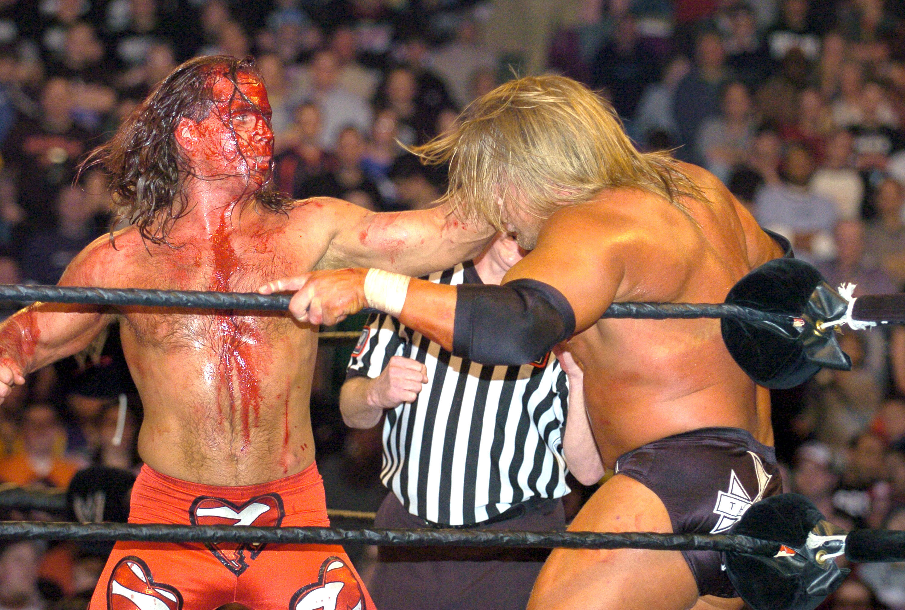 A bloody Shawn Michaels and Triple H (Photo by KMazur/WireImage)