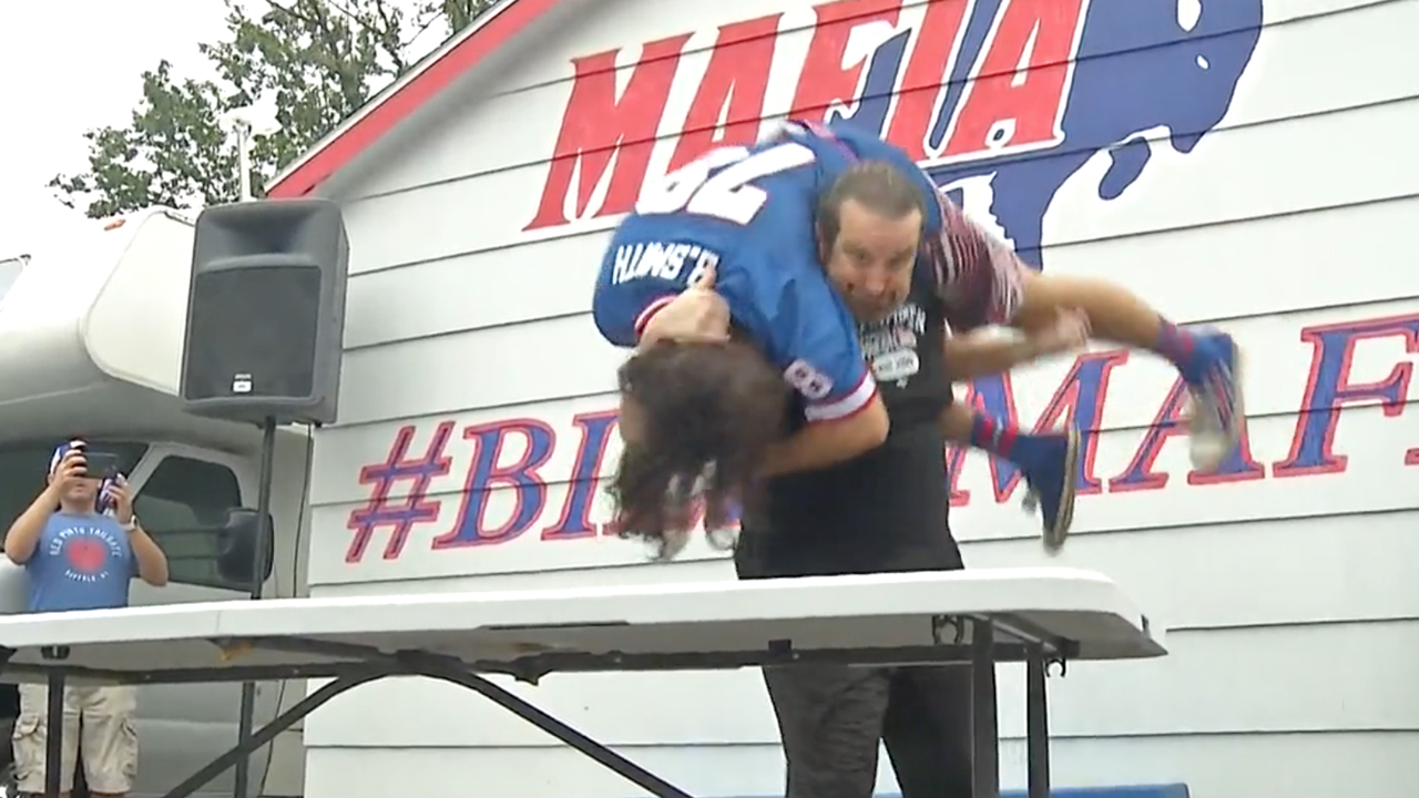 Tommy Dreamer Puts A Buffalo Fan Through A Table For Charity