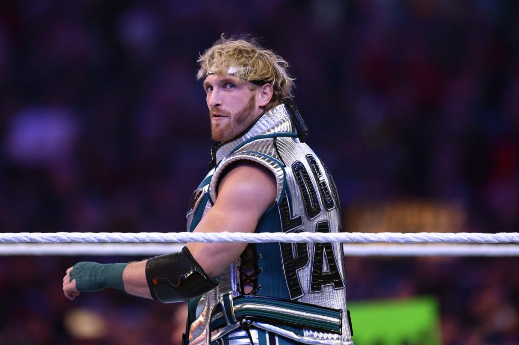 Logan Paul is introduced before a United States Triple Threat match