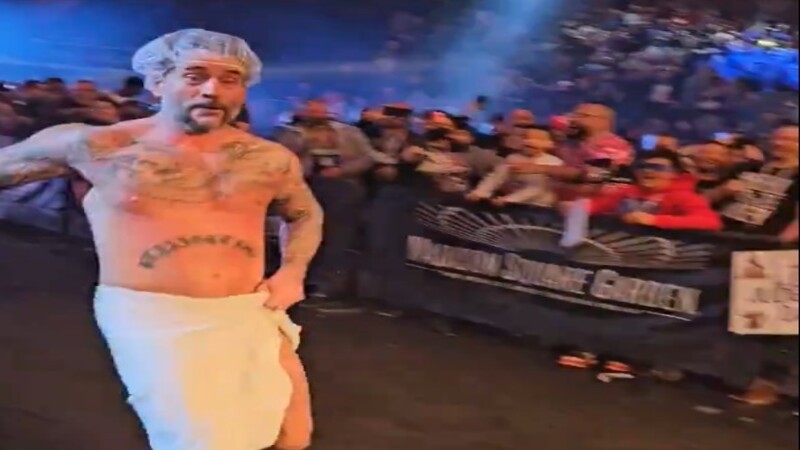 CM Punk Runs To The Ring In Towel And Shower Cap At WWE MSG Event